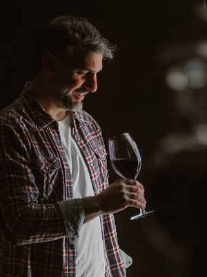 Fabricio Orlando holding a glass of wine
